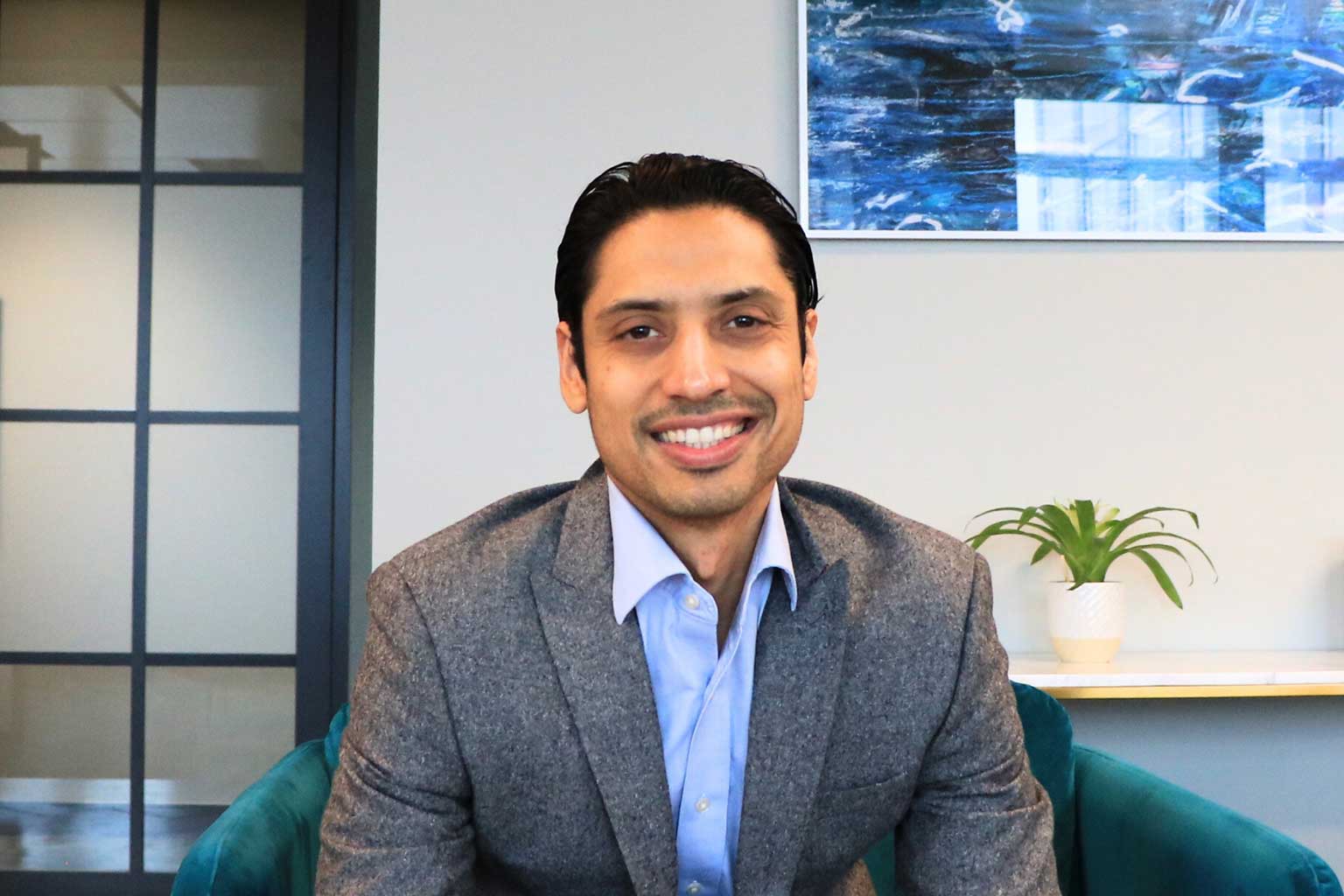 Person smiling in a modern kitchen